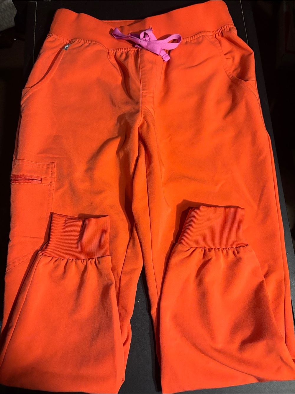 Figs Women's Bright Orange Jogger Scrub Pants with Pink Drawstring